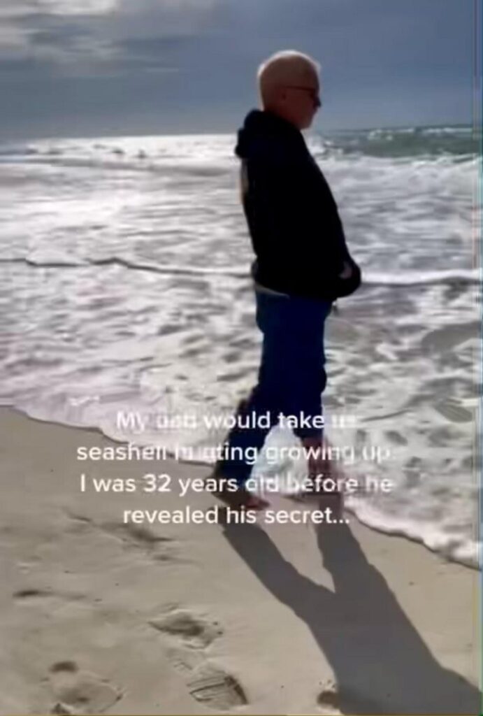 砂浜を歩く男性と父親の秘密を記した字幕